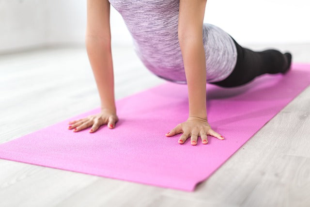 woman using a yoga mat